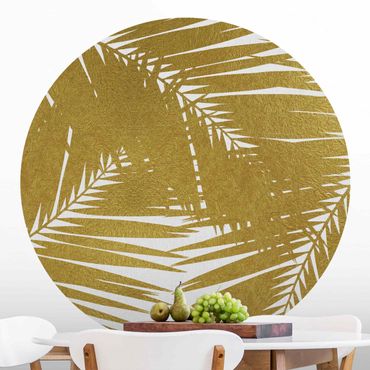 Runde Tapete selbstklebend - Blick durch goldene Palmenblätter