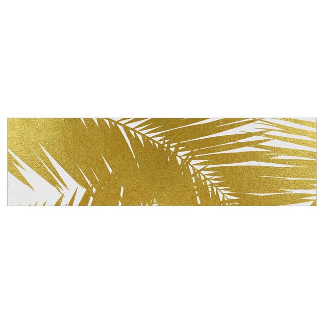 Küchenrückwand auf Maß Blick durch goldene Palmenblätter
