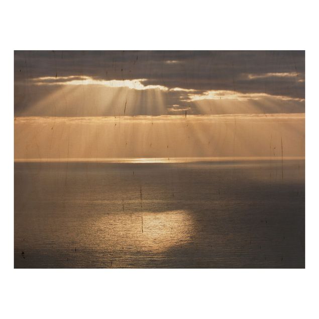 Holzbild maritim Sonnenstrahlen über dem Meer