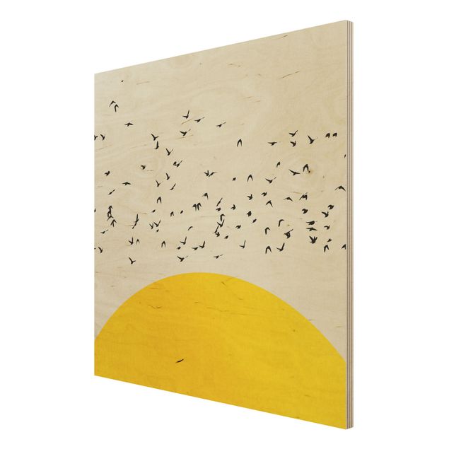 Holzbilder Vogelschwarm vor gelber Sonne