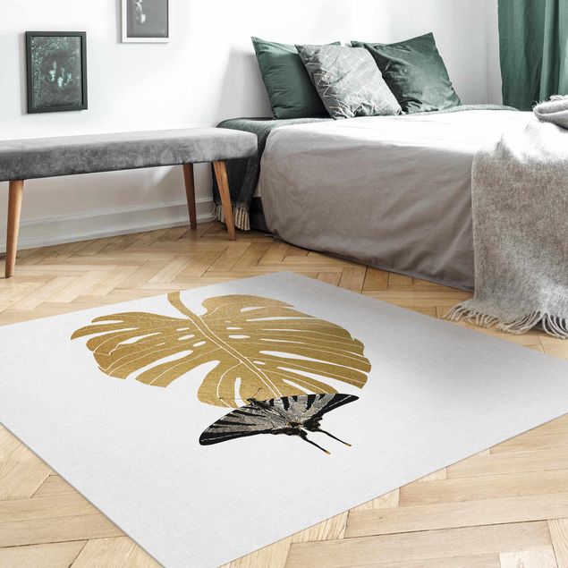 Moderner Teppich Goldene Monstera mit Schmetterling