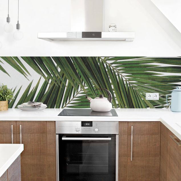 Küchenspiegel Blick durch grüne Palmenblätter