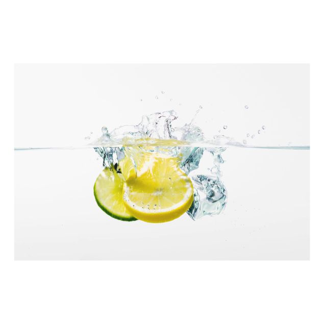Spritzschutz Glas - Zitrone und Limette im Wasser - Querformat - 3:2