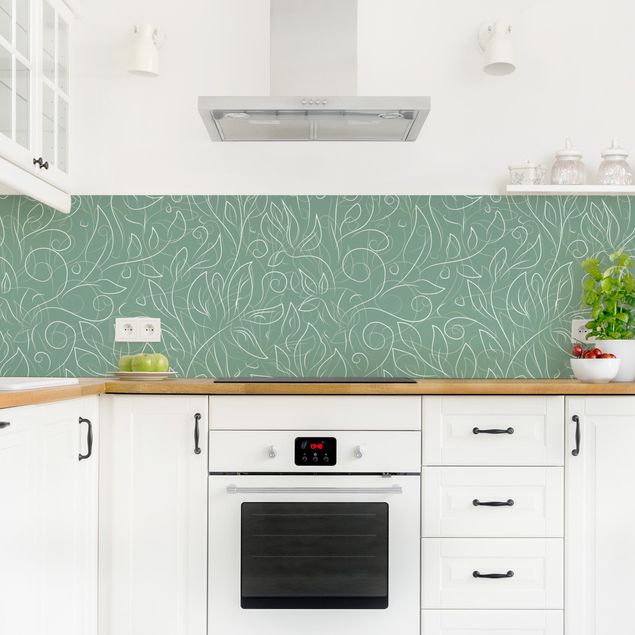 Küchenrückwand selbstklebend Wildes Pflanzen Muster auf Grün