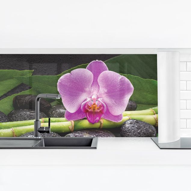 Küchenrückwand selbstklebend Grüner Bambus mit Orchideenblüte