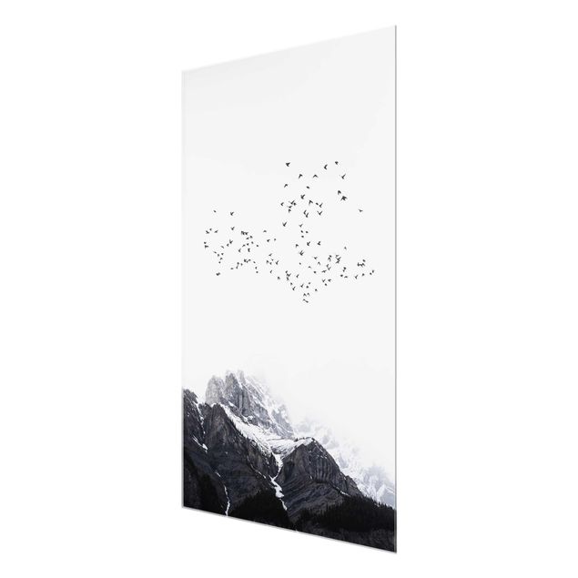 Glas Wandbilder Vogelschwarm vor Bergen Schwarz Weiß