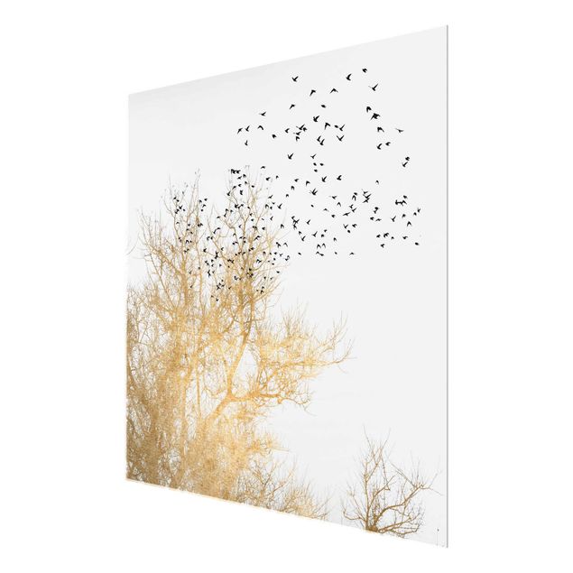Bilder auf Glas Vogelschwarm vor goldenem Baum
