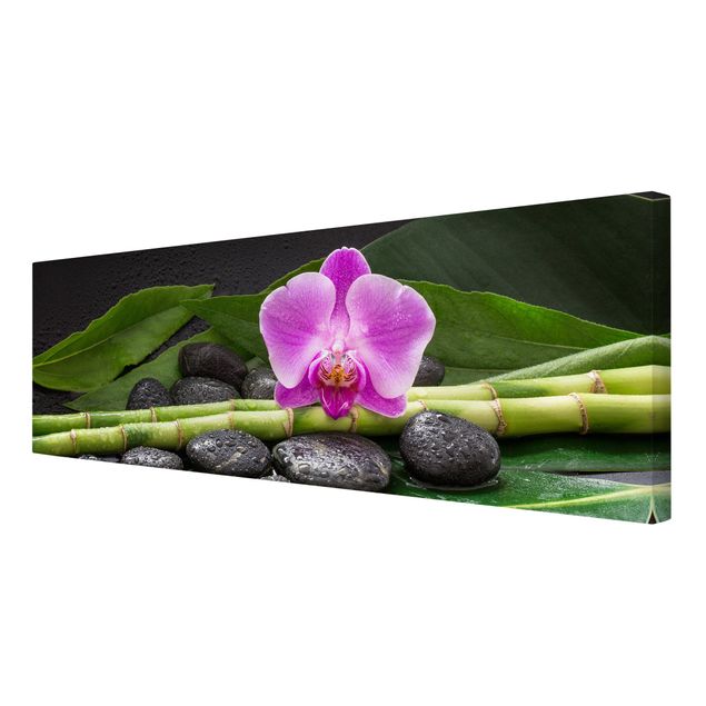 Leinwandbild - Grüner Bambus mit Orchideenblüte - Panorama 1:3