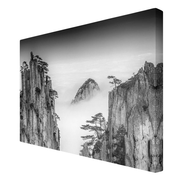 Leinwandbild - Felsen im Nebel schwarz-weiß - Querformat 2:3