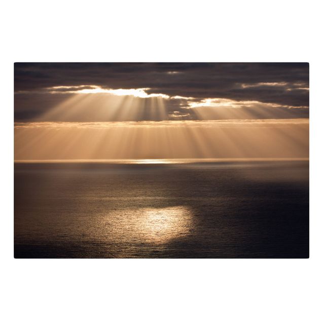 Leinwandbild - Sonnenstrahlen über dem Meer - Querformat 2:3