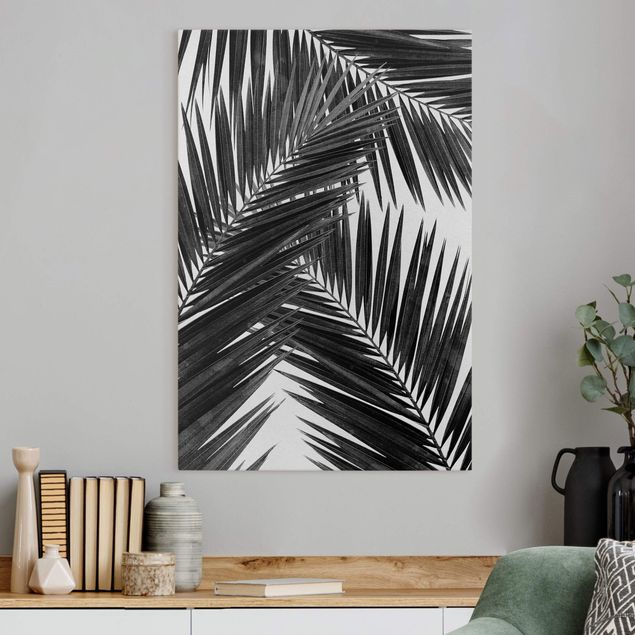 Leinwandbilder schwarz-weiß Blick durch Palmenblätter schwarz weiß