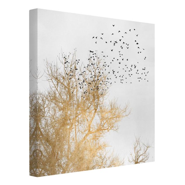 Leinwandbilder Tiere Vogelschwarm vor goldenem Baum