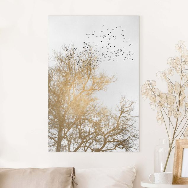 Leinwandbild Vögel Vogelschwarm vor goldenem Baum