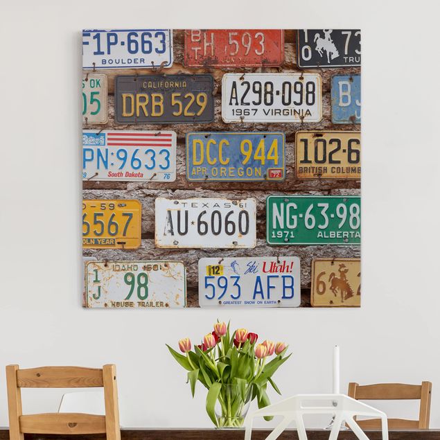 Leinwandbild mit Spruch Amerikanische Nummernschilder auf Holz