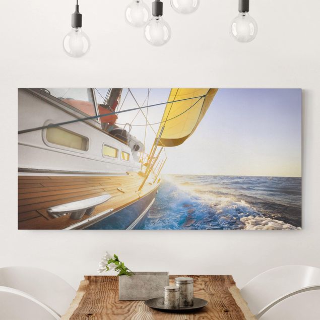Leinwandbilder Naturmotive Segelboot auf blauem Meer bei Sonnenschein