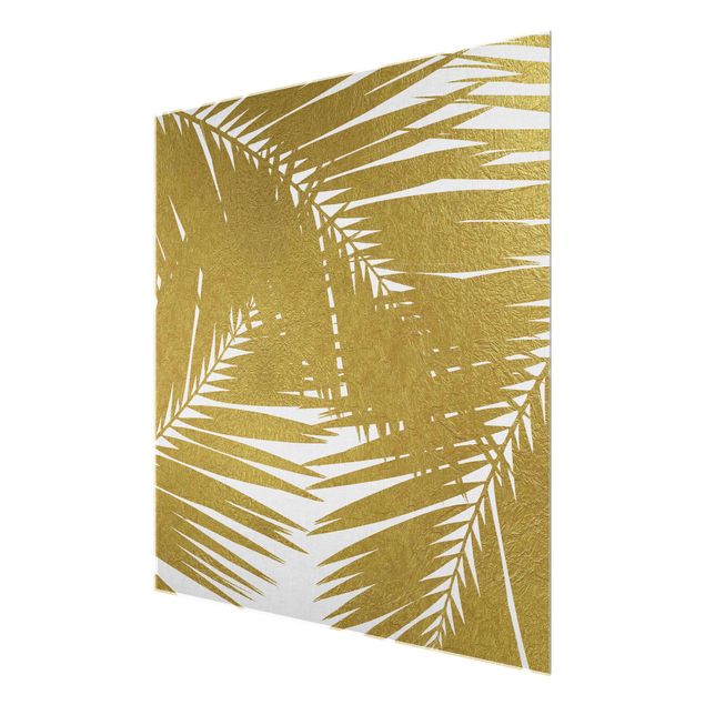 Glasbild - Blick durch goldene Palmenblätter - Quadrat