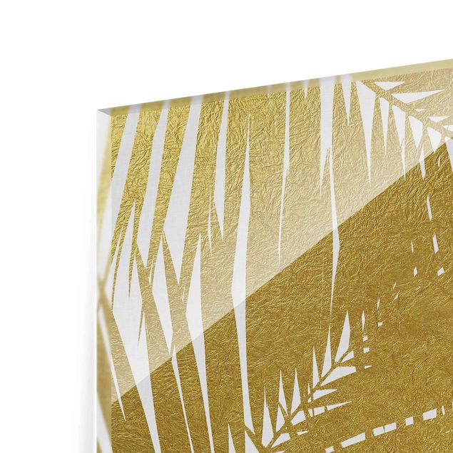 Glasbild - Blick durch goldene Palmenblätter - Hochformat