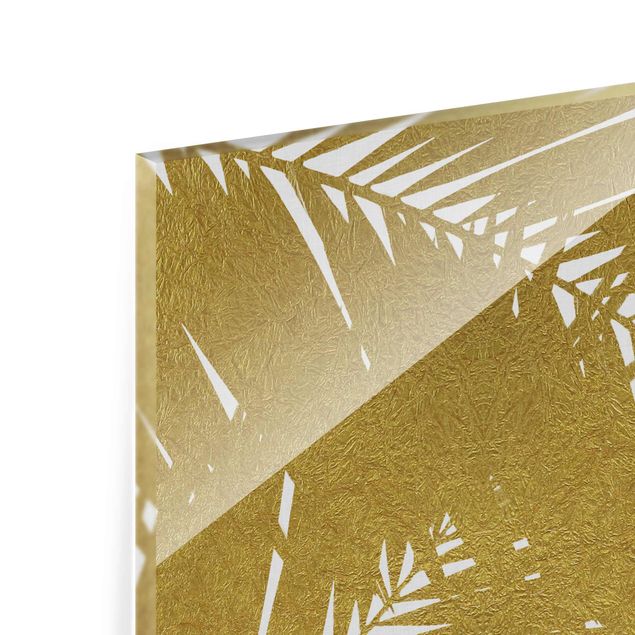Glasbild - Blick durch goldene Palmenblätter - Quadrat