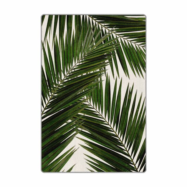 Teppich - Blick durch grüne Palmenblätter