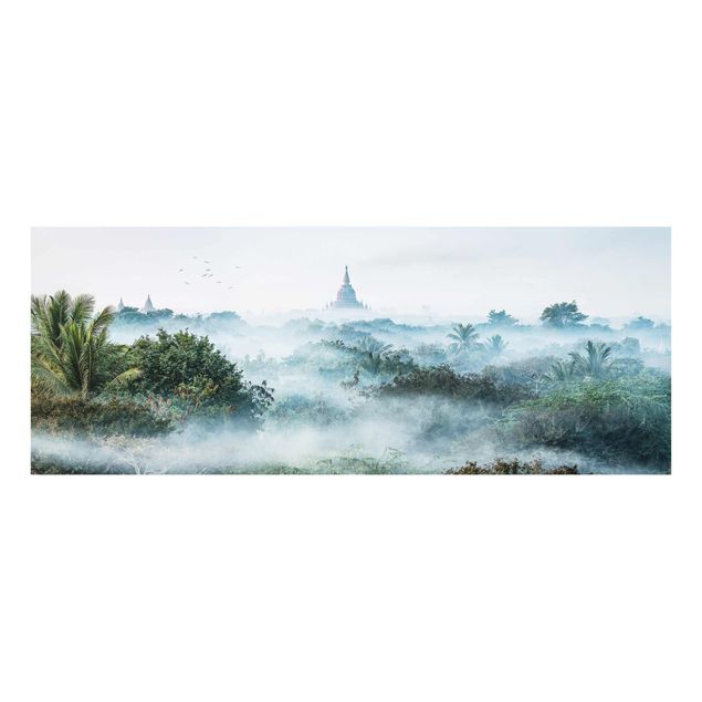 Glasbild - Morgennebel über dem Dschungel von Bagan - Panorama