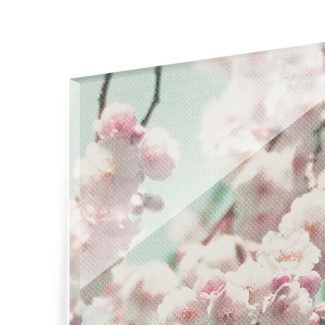 Glasbild - Kirschblütentanz auf Leinenstruktur - Hochformat