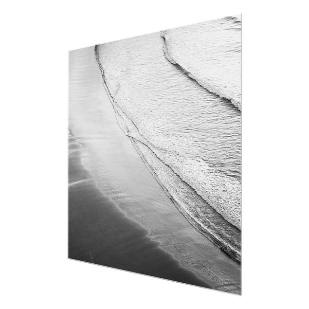 Glasbild - Leichter Wellengang am Strand Schwarz Weiß - Quadrat