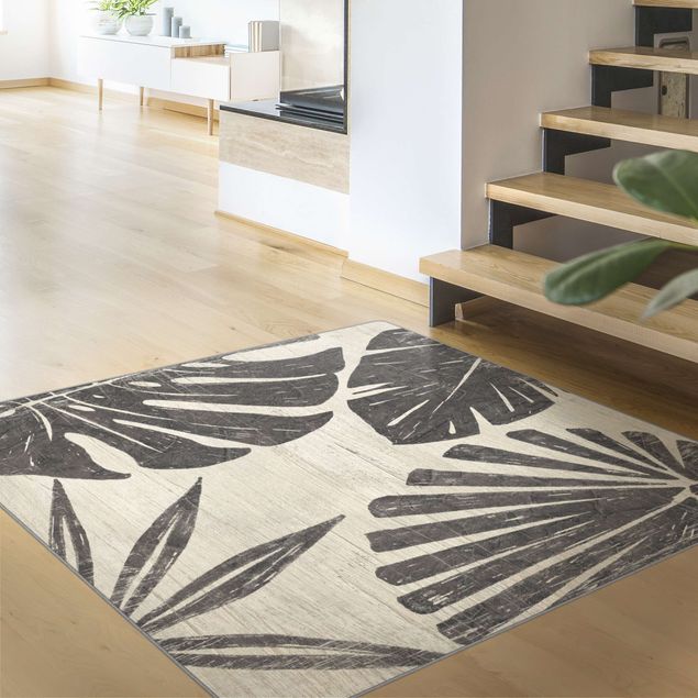 Teppich modern Palmenblätter vor Hellgrau