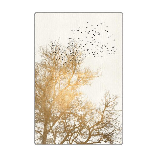Teppich - Vogelschwarm vor goldenem Baum