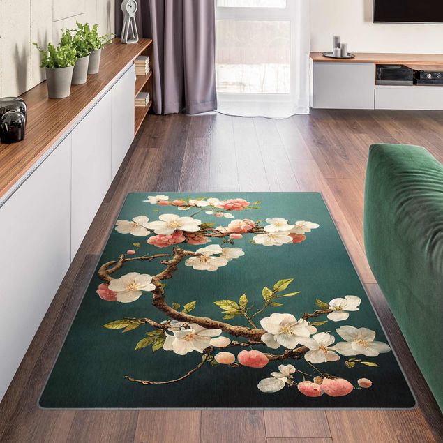 Moderne Teppiche Zweig mit Blüten auf Türkis