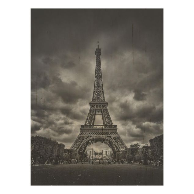 Holzbilder Syklines Eiffelturm vor Wolken schwarz-weiß