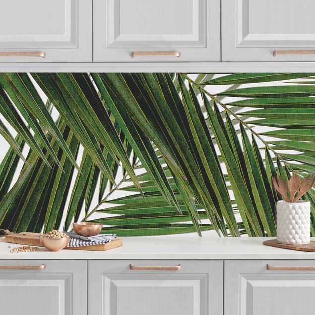 Platte Küchenrückwand Blick durch grüne Palmenblätter