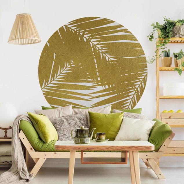 Design Tapeten Blick durch goldene Palmenblätter