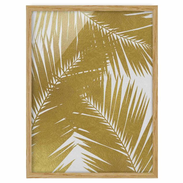 Bilder mit Rahmen Blick durch goldene Palmenblätter