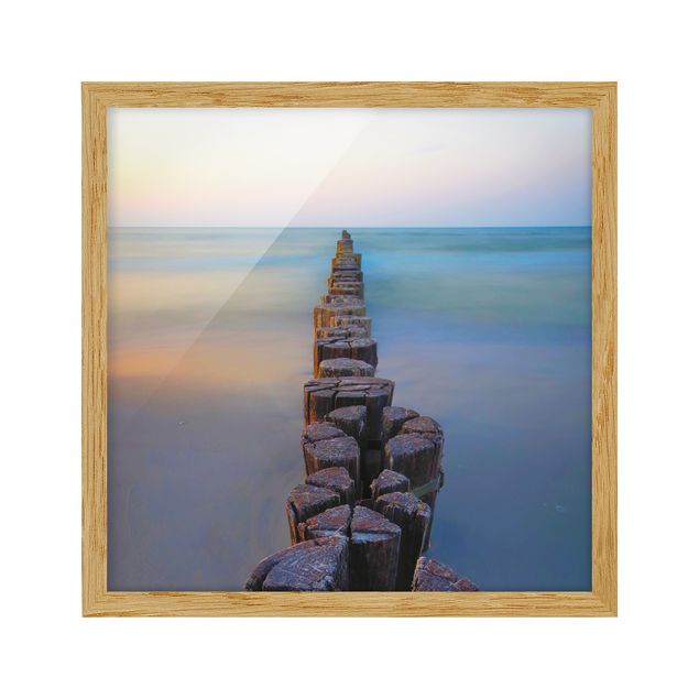 Bilder mit Rahmen Buhnen bei Sonnenuntergang am Meer