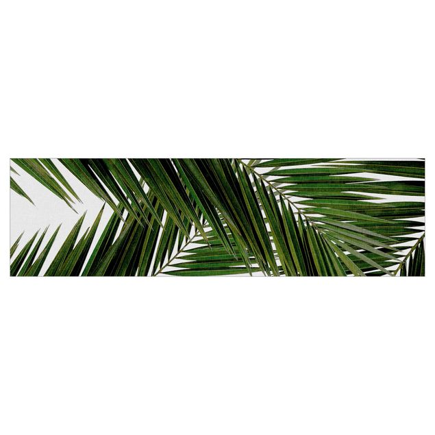 Küchenrückwand nach Maß Blick durch grüne Palmenblätter