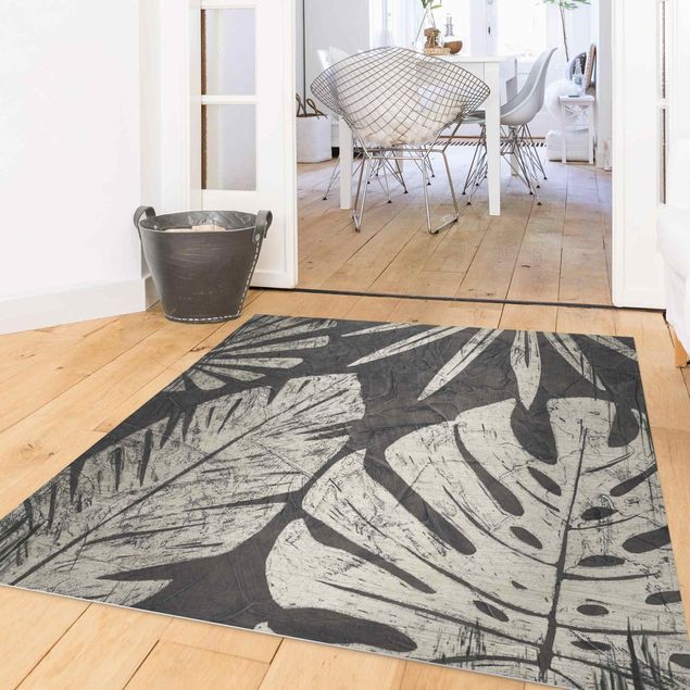 Moderner Teppich Palmenblätter vor Dunkelgrau