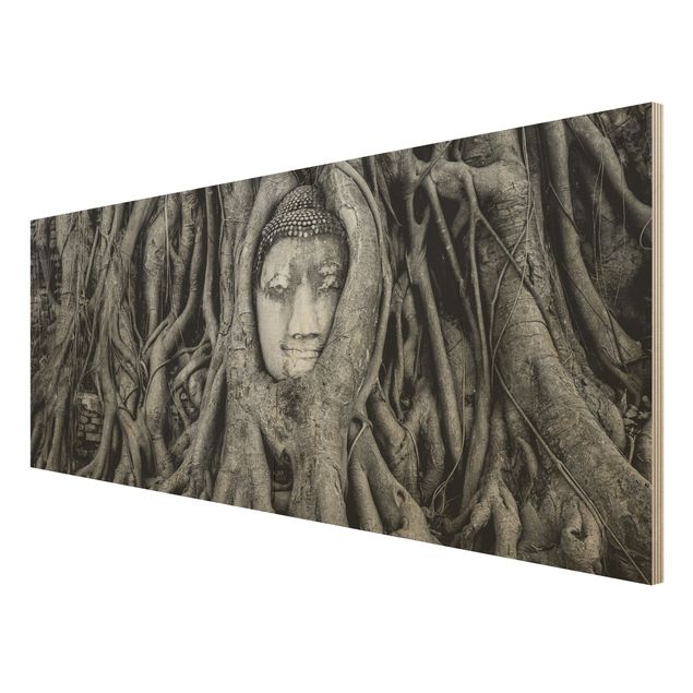 Holzbilder Syklines Buddha in Ayutthaya von Baumwurzeln gesäumt in Schwarzweiß