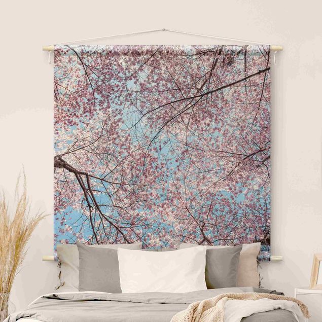 Wandbehang modern Kirschblütenzweige vor blauem Himmel