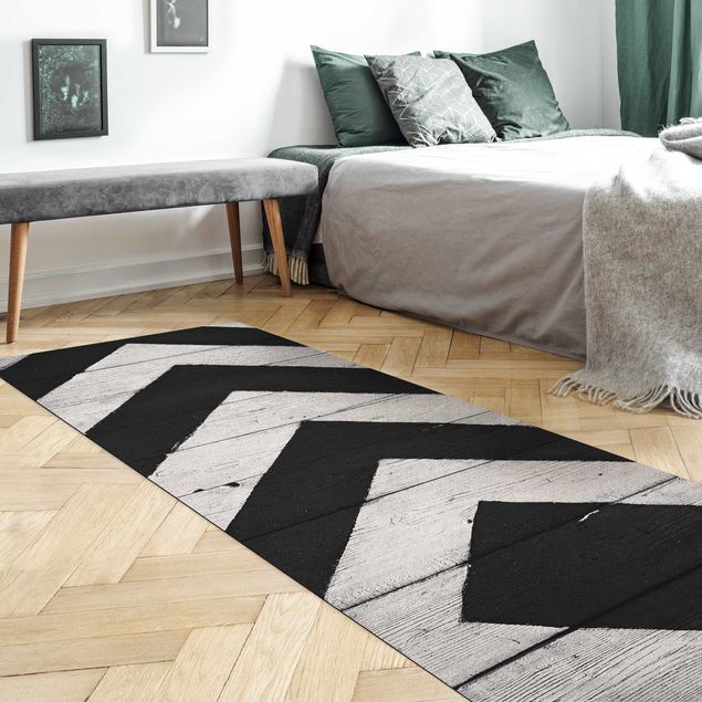 Moderner Teppich Symmetrie auf Holzbalken Weiß
