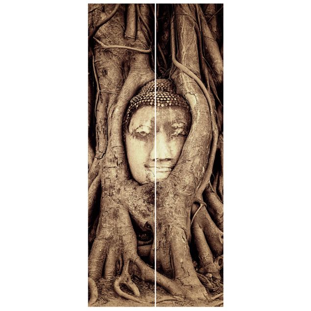 Design Tapeten Buddha in Ayutthaya von Baumwurzeln gesäumt in Braun