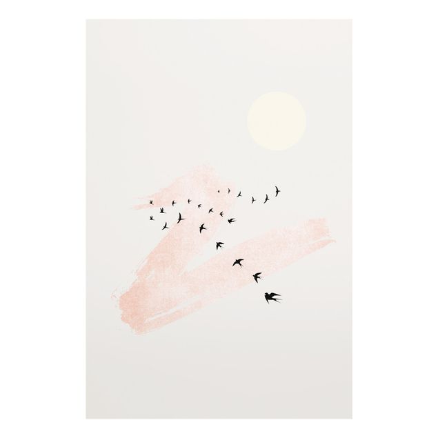 Glasbilder Vogelschwarm vor Rosa Himmel